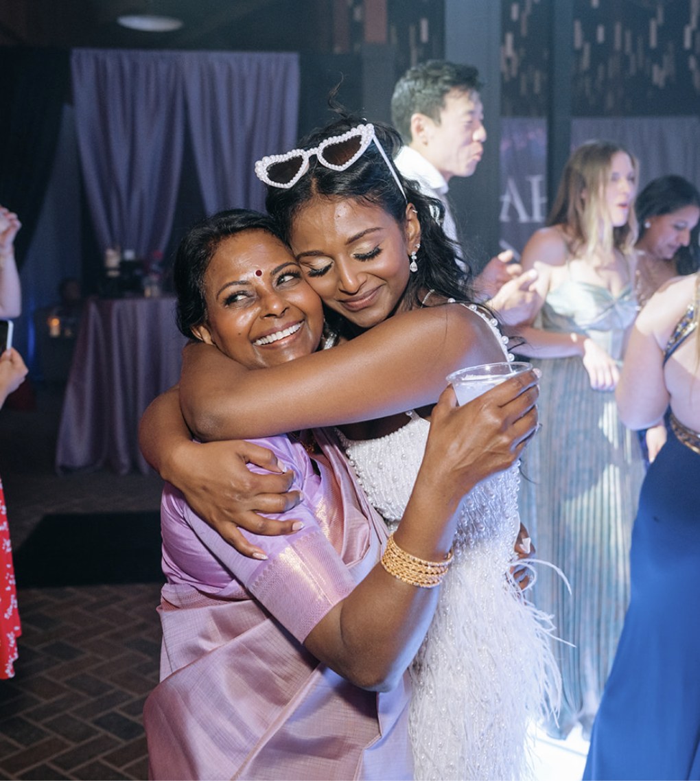 A bride hugging her mother during the gratitude ceremony at a wedding weekend